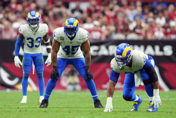 Bobby Wagner alongside safety Nick Scott (left) and Aaron Donald (right)